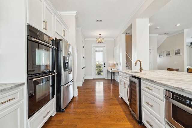 51 Grande Pointe Dr, Inlet Beach, FL 32461 - kitchen featuring wine cooler, stainless steel refrigerator with ice dispenser, a sink, ornamental molding, and white cabinets
