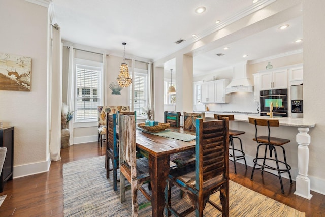 51 Grande Pointe Dr, Inlet Beach, FL 32461 - dining area featuring crown molding, baseboards, a chandelier, dark wood-type flooring, and recessed lighting