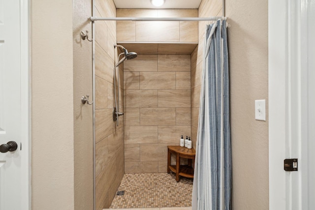 51 Grande Pointe Dr, Inlet Beach, FL 32461 - full bathroom with a stall shower and a textured wall