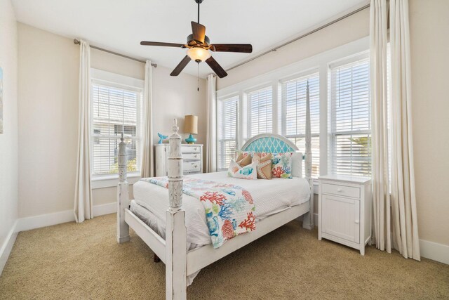 51 Grande Pointe Dr, Inlet Beach, FL 32461 - bedroom with light carpet, multiple windows, baseboards, and a ceiling fan