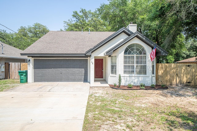 28 6th St, Shalimar, FL 32579 - ranch-style home with an attached garage, a chimney, concrete driveway, brick siding, and roof with shingles