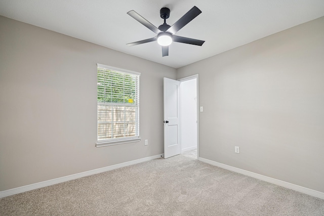 28 6th St, Shalimar, FL 32579 - empty room with light colored carpet, baseboards, and ceiling fan