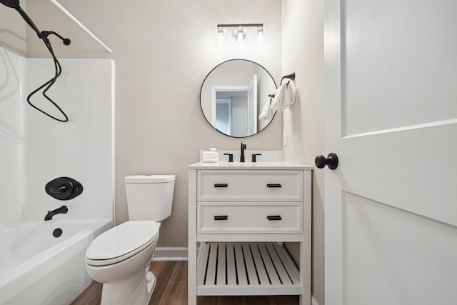 28 6th St, Shalimar, FL 32579 - bathroom with tub / shower combination, toilet, vanity, wood finished floors, and baseboards