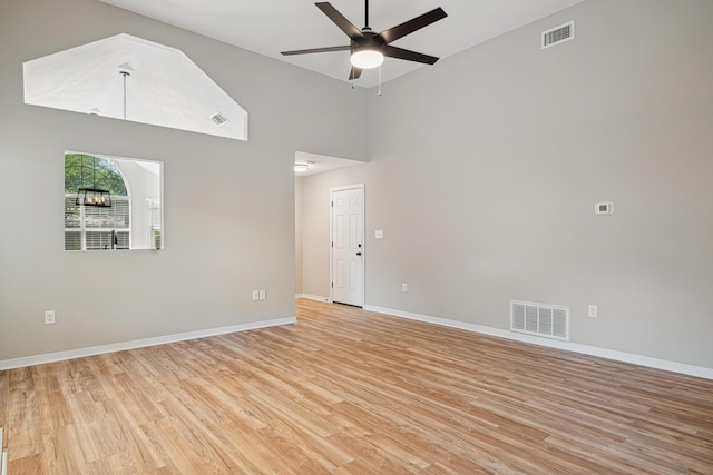 28 6th St, Shalimar, FL 32579 - unfurnished room with a ceiling fan, light wood finished floors, baseboards, and high vaulted ceiling