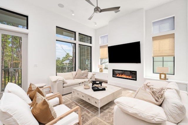 LOT36 Grande Pointe Cir, Inlet Beach, FL 32461 - living area featuring a glass covered fireplace and a ceiling fan