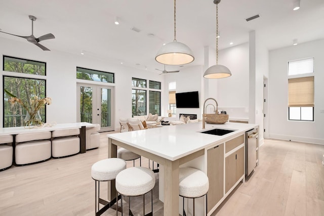 LOT36 Grande Pointe Cir, Inlet Beach, FL 32461 - kitchen with a sink, open floor plan, an island with sink, light wood-style floors, and recessed lighting