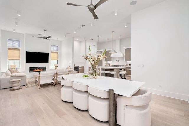 LOT36 Grande Pointe Cir, Inlet Beach, FL 32461 - dining room featuring a ceiling fan, light wood-style flooring, a fireplace, recessed lighting, and baseboards