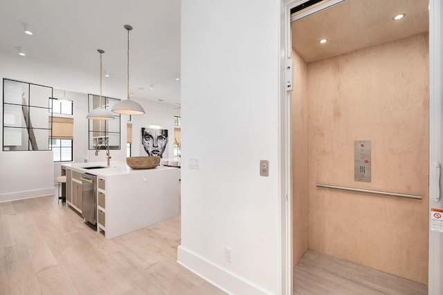 LOT36 Grande Pointe Cir, Inlet Beach, FL 32461 - kitchen featuring elevator, light wood finished floors, stainless steel dishwasher, a sink, and recessed lighting