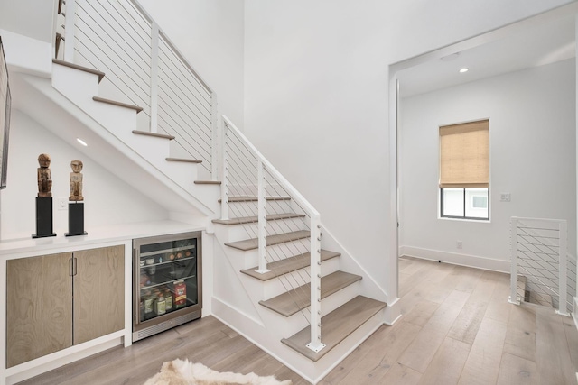LOT36 Grande Pointe Cir, Inlet Beach, FL 32461 - stairs featuring beverage cooler, recessed lighting, wood finished floors, a bar, and baseboards