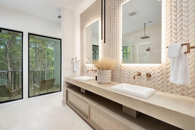 LOT36 Grande Pointe Cir, Inlet Beach, FL 32461 - full bathroom featuring double vanity, walk in shower, decorative backsplash, and tile patterned flooring