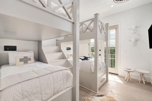 LOT36 Grande Pointe Cir, Inlet Beach, FL 32461 - bedroom featuring multiple windows, light wood finished floors, baseboards, and recessed lighting