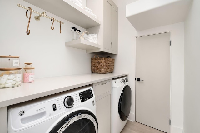 LOT36 Grande Pointe Cir, Inlet Beach, FL 32461 - washroom with cabinet space, washer and dryer, and light wood-style flooring