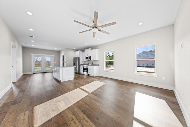 1354 Georgia Ave, Baker, FL 32531 - unfurnished living room with healthy amount of natural light, dark wood finished floors, a ceiling fan, french doors, and recessed lighting
