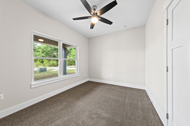 1354 Georgia Ave, Baker, FL 32531 - unfurnished room with dark colored carpet, baseboards, and ceiling fan