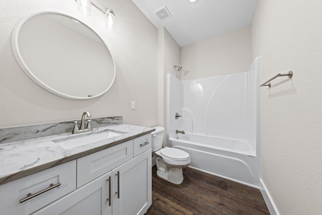 1354 Georgia Ave, Baker, FL 32531 - bathroom with wood finished floors, vanity, toilet, and tub / shower combination