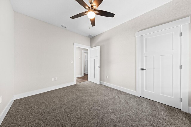 1354 Georgia Ave, Baker, FL 32531 - unfurnished bedroom featuring carpet, baseboards, and ceiling fan