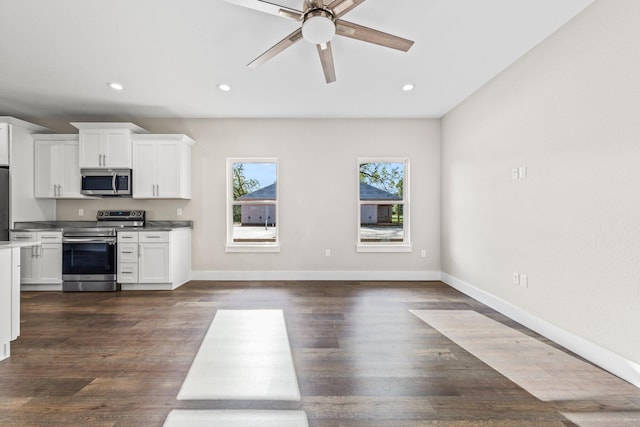 1354 Georgia Ave, Baker, FL 32531 - kitchen with appliances with stainless steel finishes, a ceiling fan, white cabinets, recessed lighting, and dark wood-style floors
