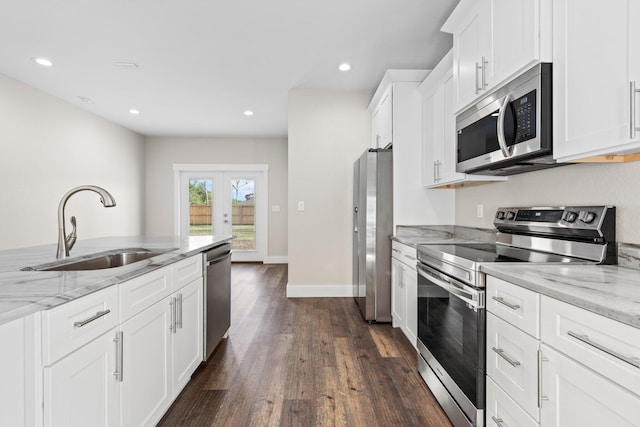 1354 Georgia Ave, Baker, FL 32531 - kitchen featuring stainless steel appliances, a sink, french doors, dark wood finished floors, and white cabinets