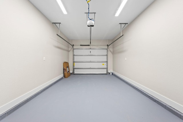 1354 Georgia Ave, Baker, FL 32531 - garage featuring baseboards and a garage door opener