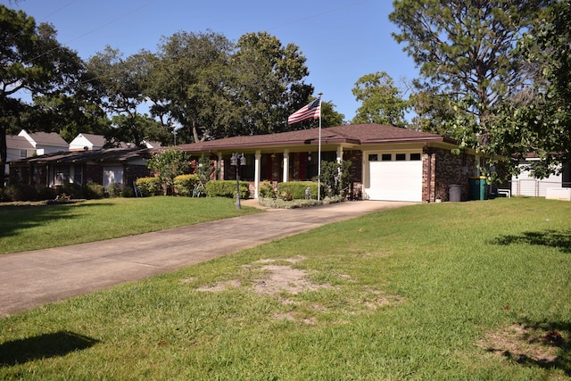 22 10th St, Shalimar, FL 32579 - view of front facade with a garage, driveway, a front yard, and brick siding