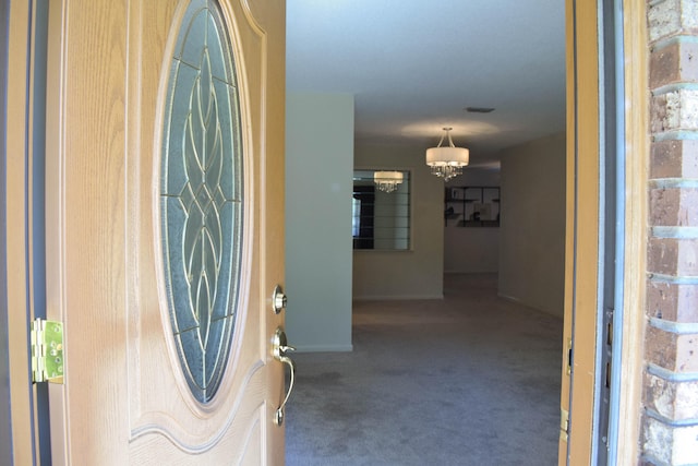 22 10th St, Shalimar, FL 32579 - carpeted entryway with a chandelier