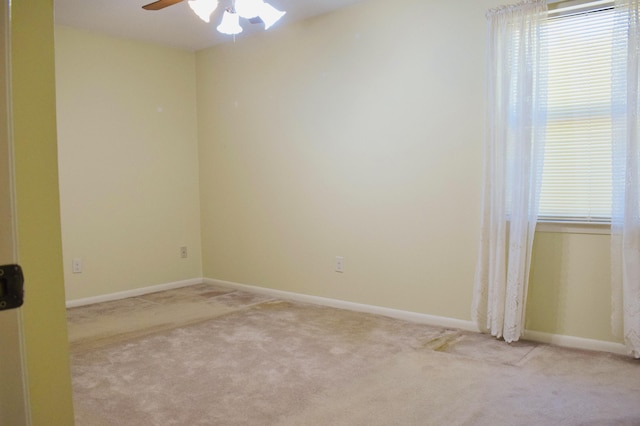 22 10th St, Shalimar, FL 32579 - spare room featuring light colored carpet, a ceiling fan, healthy amount of natural light, and baseboards