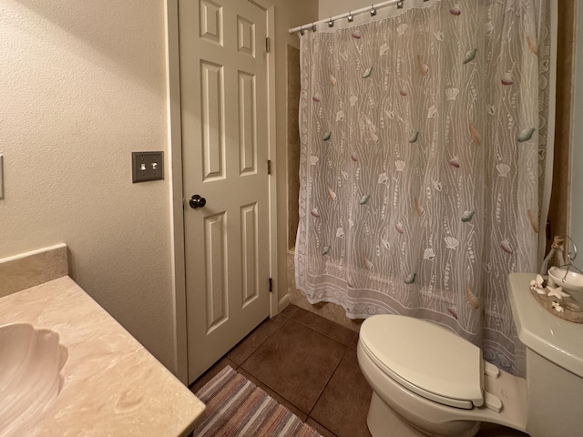 22 10th St, Shalimar, FL 32579 - bathroom with toilet, vanity, and tile patterned flooring