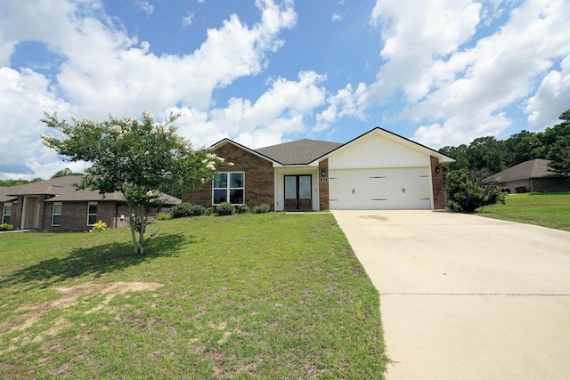 415 Scooter Cv, Crestview, FL 32539 - view of front facade with brick siding, concrete driveway, french doors, and a garage