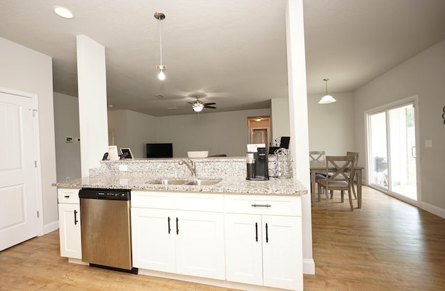 415 Scooter Cv, Crestview, FL 32539 - kitchen with stainless steel dishwasher, a sink, light wood-style flooring, a ceiling fan, and light stone counters