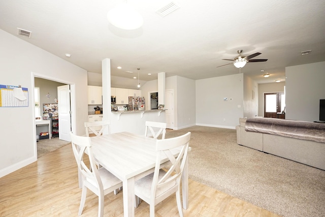 415 Scooter Cv, Crestview, FL 32539 - dining area featuring baseboards, ceiling fan, and light wood-style flooring