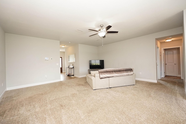 415 Scooter Cv, Crestview, FL 32539 - living area featuring carpet flooring, a ceiling fan, and baseboards