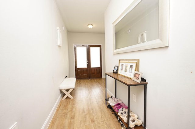 415 Scooter Cv, Crestview, FL 32539 - entryway featuring light wood-type flooring, baseboards, and french doors