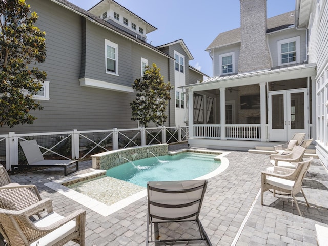 44 Tidepool Ln, Watersound, FL 32461 - view of pool featuring a fenced backyard, a patio area, a sunroom, and french doors