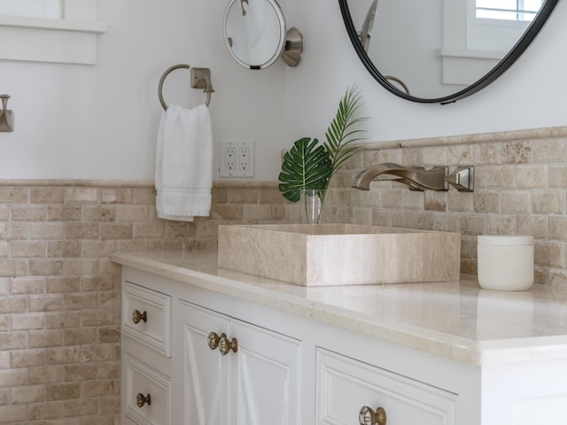 44 Tidepool Ln, Watersound, FL 32461 - bathroom featuring vanity, tile walls, and a wainscoted wall