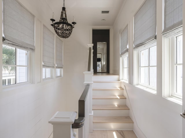 44 Tidepool Ln, Watersound, FL 32461 - staircase featuring a chandelier