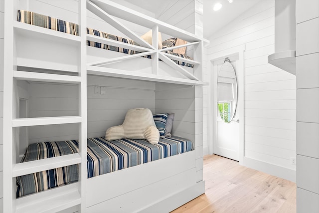 44 Tidepool Ln, Watersound, FL 32461 - bedroom with lofted ceiling and wood finished floors