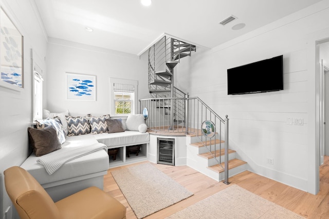 44 Tidepool Ln, Watersound, FL 32461 - living area with wine cooler, stairway, wood finished floors, and recessed lighting