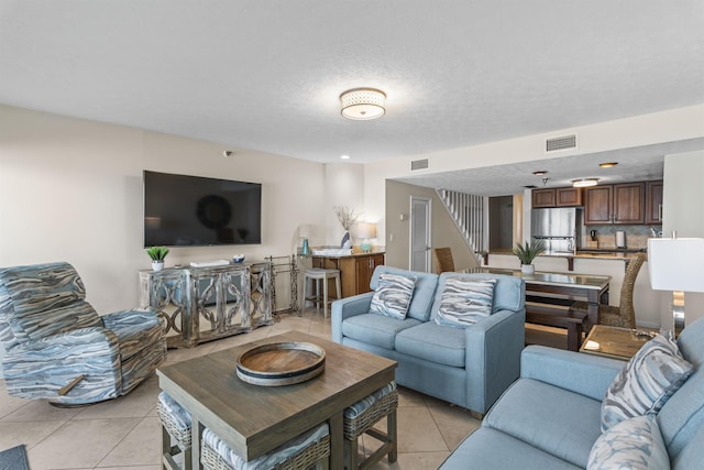 1700 Scenic Highway 98 Unit 207, Destin, FL 32541 - living area with light tile patterned floors and a textured ceiling