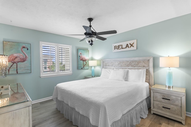 1700 Scenic Highway 98 Unit 207, Destin, FL 32541 - bedroom with wood finished floors, baseboards, and ceiling fan