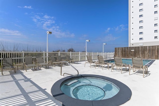 1700 Scenic Highway 98 Unit 207, Destin, FL 32541 - community pool featuring a community hot tub and a patio area