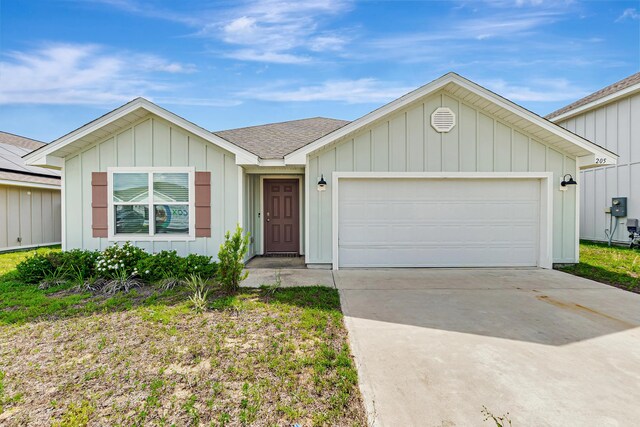 205 Laurel Hill St, Crestview, FL 32539 - single story home featuring driveway, board and batten siding, a garage, and a shingled roof