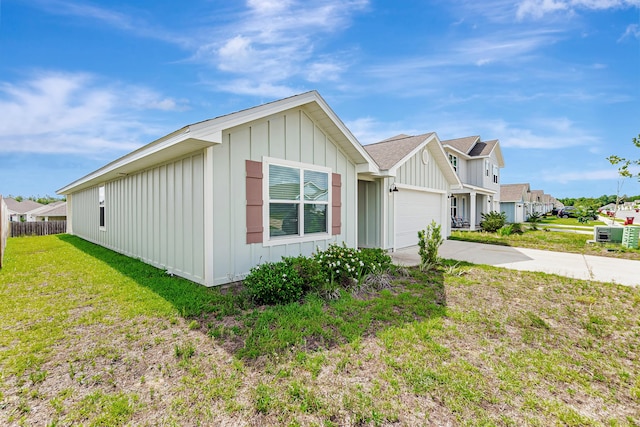 205 Laurel Hill St, Crestview, FL 32539 - view of home's exterior featuring board and batten siding, driveway, a garage, and roof with shingles