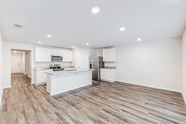 205 Laurel Hill St, Crestview, FL 32539 - kitchen featuring stainless steel appliances, light wood-style floors, baseboards, and recessed lighting