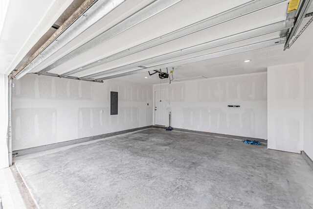205 Laurel Hill St, Crestview, FL 32539 - garage with electric panel, a garage door opener, and recessed lighting