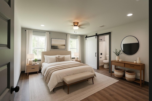4618 Eagle Way, Crestview, FL 32539 - bedroom with a barn door, wood finished floors, recessed lighting, ensuite bathroom, and ceiling fan