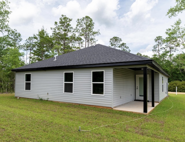 4618 Eagle Way, Crestview, FL 32539 - back of property with roof with shingles, a patio, and a lawn