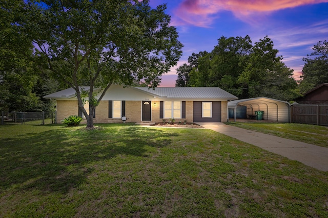 306 Forrest Pkwy, Crestview, FL 32539 - single story home featuring concrete driveway, a detached carport, metal roof, and brick siding