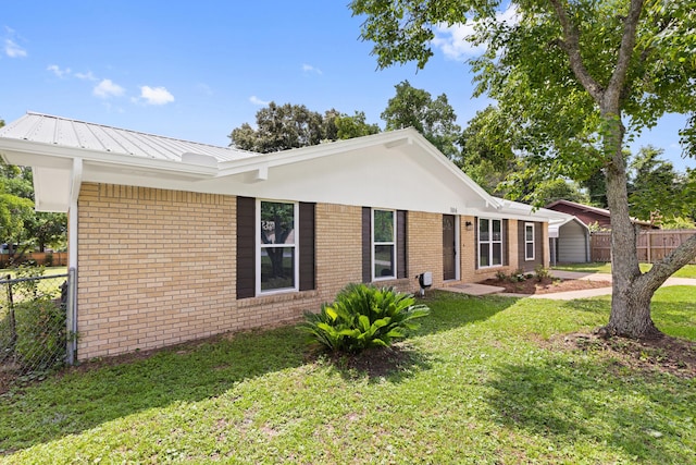 306 Forrest Pkwy, Crestview, FL 32539 - view of front of home featuring brick siding and metal roof