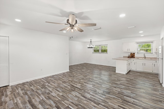 306 Forrest Pkwy, Crestview, FL 32539 - unfurnished living room featuring a sink, dark wood-style floors, a ceiling fan, recessed lighting, and healthy amount of natural light