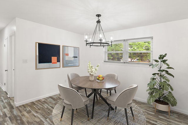 306 Forrest Pkwy, Crestview, FL 32539 - dining area with a chandelier, wood finished floors, and baseboards